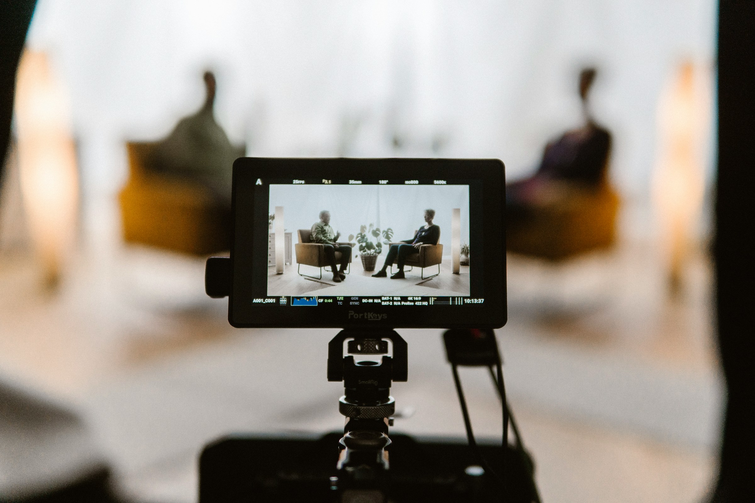 Two-person crew filming on an industrial production shoot